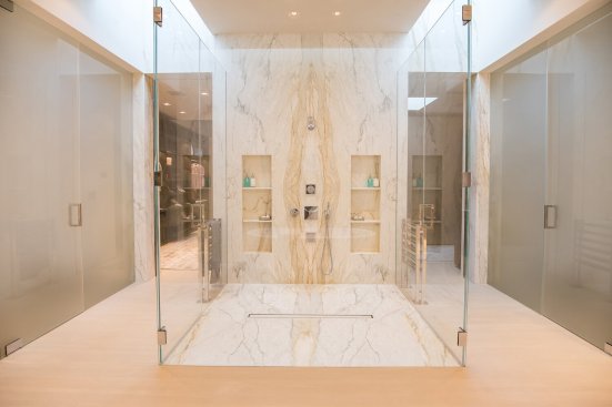 Custom marble shower at modern Beverly Hills home.