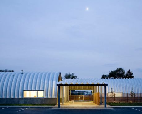 Located in a rural setting, the vaulted structures provide a stunning contrast to the flat landscape.