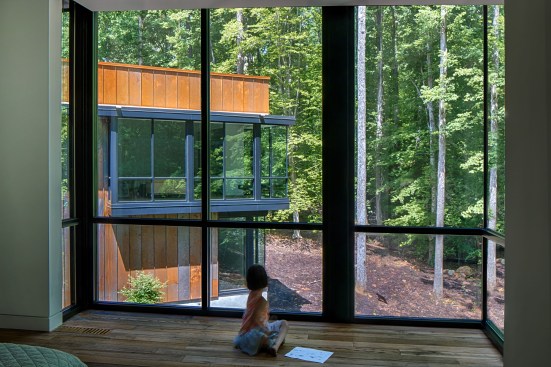 The two halves of the house face each other across a courtyard. As a result, the homeowners can enjoy the exterior of their new house from the interior and watch the steel reach its ultimate patina.