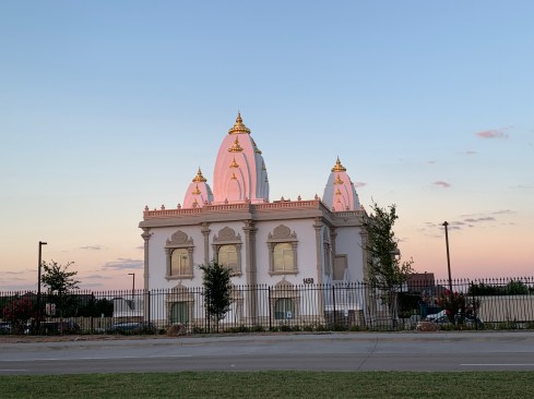 West Elevation. Steeples (Shikhars) reflecting the colors of the sunset.
