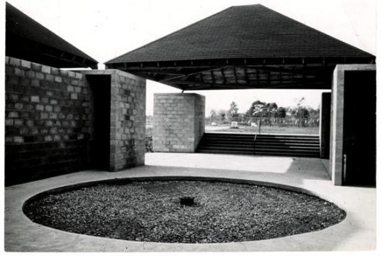 When the bath house was completed in 1955, the central plaza around which the four-pavilion complex is oriented was inscribed with an inset circle and filled with gravel. Meant to mimic a fountain, at least in prominence, and to serve as a focal point for the complex, the circle was filled in with concrete over time to comply with ADA codes for universal access.