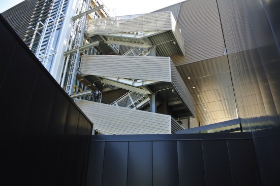 A wide outdoor staircase clad in perforated aluminum panels leads guests to the hasting and Hospitality space above the atrium. Metal played an active role in the building’s architectural expression.