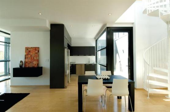 The units feature wide-plank maple floors and floor-to-ceiling windows.