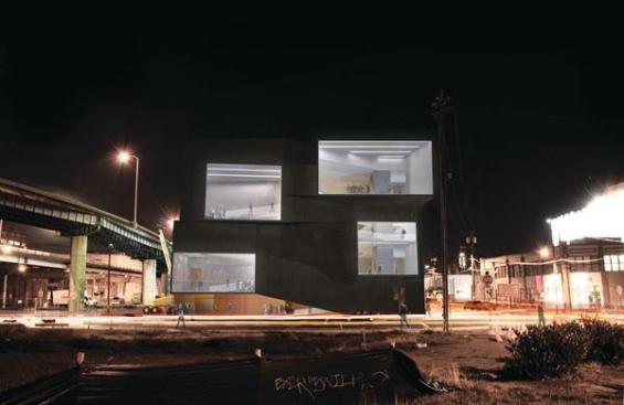 The four large projecting window bays on the south fa?ade correspond to landing areas on the circulation ramps. When a concert is under way, the interior lighting creates a stark contrast against the black rubber siding and puts the spectators on display to drivers on the neighboring highway.