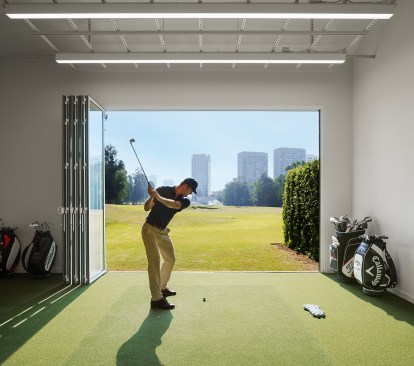 11-foot tall folding doors allowing golfers to swing out of the building down the 400-yard driving range
