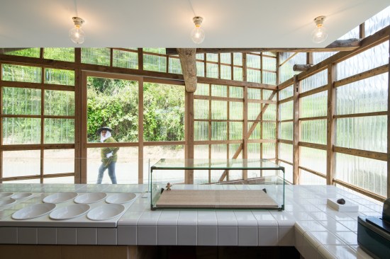 Polycarbonate facade allows visitors to take a look inside of the shop