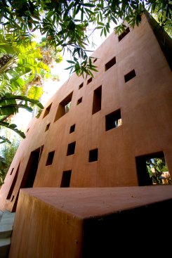 Mandeville Canyon modern home exterior with geometric cutout windows 