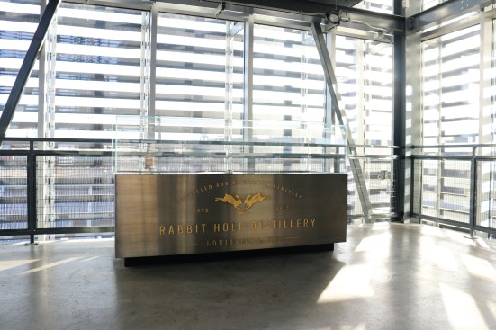 The “High Wine Spirit Safe” with gold letter inlay, made by Vendome Copper & Brass Works, sparkles in the sunlight that slips between the Manufacturing Atrium’s louvers. 