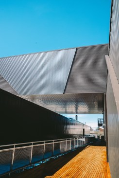 An innovative system of parts turned a standard metal wall material into a formalized metal skin system adapted specifically for this project.  