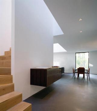 The ebony or zebra wood casework floats off the ground and is thought of as a more animated element, architect David Jameson says.