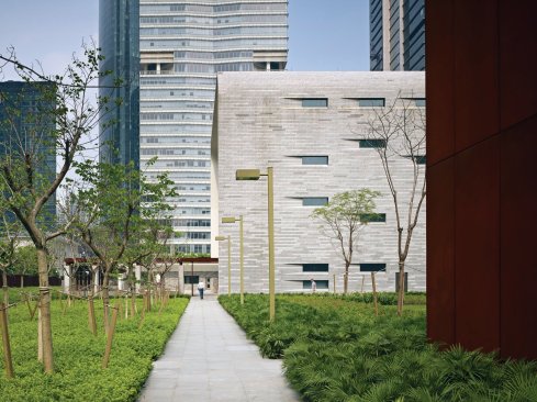 A locally quarried stone clads the consulate exterior.