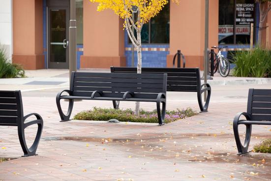 Trio Benches shown in 6 foot, backed configuration with Black Texture powdercoated frame, extruded aluminum slats and two armrests at BART, Pleasant Hill/Contra Costa Centre Station, Walnut Creek, California