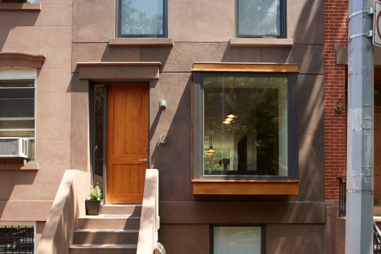 Mahogany casing around the new bay window, coupled with a custom mahogany entry door, gives a contemporary feel but harks back to more traditional elements.
