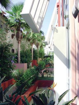 This six-unit project is sited on a narrow 50-foot lot, yet 22 feet are dedicated to an open courtyard. Delineated by bold colors, each unit has a four-story atrium skylight that also acts as a thermal chimney to pull warm air out of the interiors.