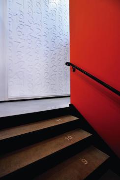 Spanish Education Development Center Brightly colored paint and numbers on the stair treads are among the inexpensive measures used to make the space child-friendly.