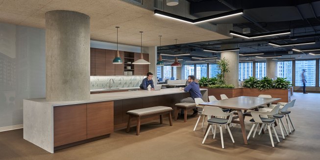 Small meeting room with curved glass front. 