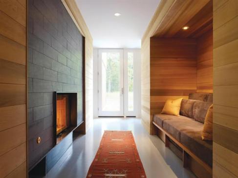 With a flush fireplace and built-in seat, the entry hall becomes an inglenook.