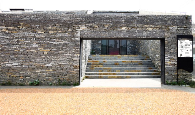 Drying corn in front of the main entrance