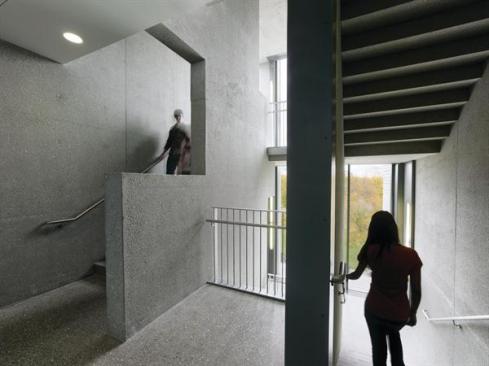 The+fire+stairs+serve+as+the+building%e2%80%99s+main+vertical+circulation%2c+and+offer+views+of+the+campus.