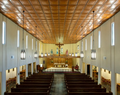 The renovated sanctuary, with the new crucifix, rood beam, reredos, and pulpit. 