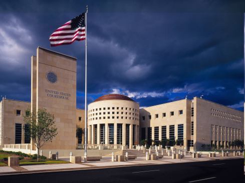 U.S. Courthouse-Laredo, TX The design for this new 148,000-square-foot federal courthouse draws on regional heritage as well as classic architectural elements to make a bold statement in the context of Laredo's existing civic architecture. To accommodate stringent security guidelines, the internal public spaces have all been oriented toward the building's rotunda and landscaped plaza, which also eases way-finding throughout the building. Three separate circulation systems were required: public, defendants in custody, and a private zone for judges, juries, and staff. The three functional elements are expressed as discrete forms. A long, narrow wing along the north houses office areas and optimizes sunlight; court spaces are in a three-story structure defining the east edge; and the entry lobby, including screening functions, is housed in a rotunda at the intersection of these two wings. Simple yet powerful monumental forms, elegantly detailed, express the permanence and dignity of the United States courts.
Architect: HDR Architecture
