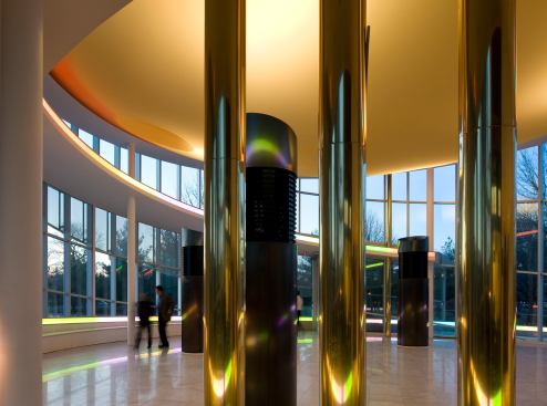 Queens Theatre-in-the-Park-Queens, New York&nbsp; A place of reconnections, this theater features additions that build upon the playful circular geometries of the original 1964 Philip Johnson World’s Fair complex. It is a party room for the borough, whose rich materials and sunset colors are understood as festive by a wide cross-section of the 109 ethnic cultures that are the glory of Queens. The new structure is a 600-person reception room for the borough, standing on axis with the giant oval of Johnson's New York State Pavilion. 
Architect: Caples Jefferson Architects/Lee Timchula Architects