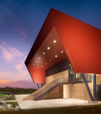 Boulder Regional Fire Training Facilities-Boulder, Colorado&nbsp;The 18,000-square-foot Boulder Regional Training Facilities building is adjacent to the publically accessible Boulder Reservoir in Boulder County. The facility consists of a 10-acre fire training center, including an administration building, burn building, drill tower, and various training props. The sloping wedge form of the building rises from the bermed site perimeter to enclose higher volume spaces and second-level classroom/observation hub, creating an iconic agrarian form respectful of its rural context. 
Architect: Roth + Sheppard Architects / TCA Architecture Panning