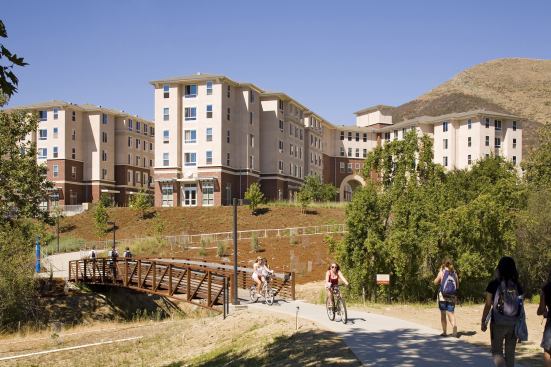 Poly Canyon Village-San Luis Obispo, California&nbsp; MVE Institutional designed 868 units with 2,700 beds into nine structures, each four to five stories high, and arranged to secure sightlines to surrounding hillsides for more than 90 percent of occupants. The nine structures are divided into three “neighborhoods” defined by topography, social considerations, and architectural details. The neighborhoods reflect the mixed Mediterranean architectural traditions of California Polytechnic State University and of California’s Central Coast. Each of the neighborhoods has informal outdoor gathering spaces, courtyards, common lobbies, and study areas. In the main square, or “town center,” are retail services, including a market, coffee, casual dining outlets, copy shop, and the student-run “Canyon Post.” 
Architect: MVE Insitutional / Niles Bolton and Associates
