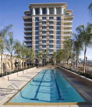 The Plaza Irvine-Irvine, CA The Plaza Irvine is a timeless condominium high-rise development blending contemporary architecture and luxury amenities into resort-style living. As one of the first for-sale, high-rise residential developments in Orange County, it created a vibrant vertical neighborhood where residents socialize and interact as if they were living in street-level single-family units. The matching towers embrace the region's climate and surroundings through design that artfully balances indoor and outdoor living with privacy and views. Rising 15 stories to take advantage of an urban location with dramatic sight lines and a sunny, temperate clime, the dual towers endow each condo with a seven-foot deep balcony that invites enjoyment of the outdoors and expands the amount of living space. High-quality construction materials, neutral palette, and floor-to-ceiling windows and sliding glass doors, define Southern California living. 
Architect: MVE&nbsp;& Partners