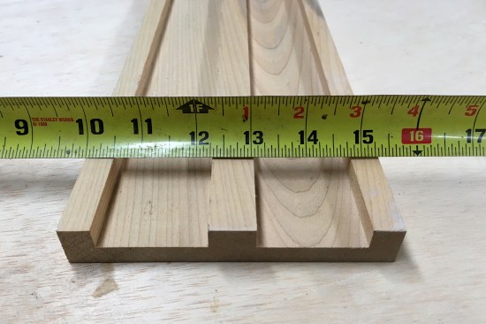 Back face of sample 1x6 showing the grooves that helped workers curve the wood for the soffit.