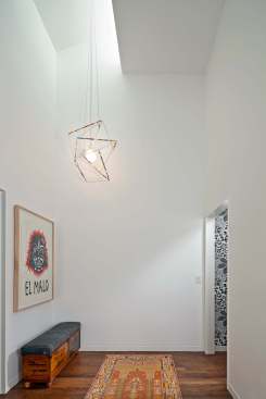  The white walls and uncluttered, sleek design give the impression of wide space.