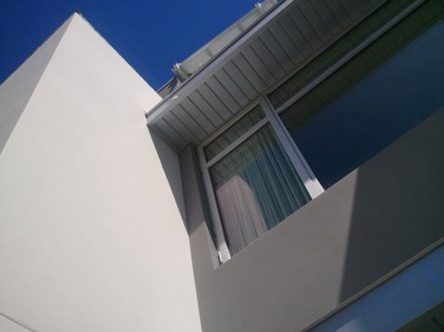 Anodized aluminum “eyebrow” shades are coated with Kynar, a durable resin.