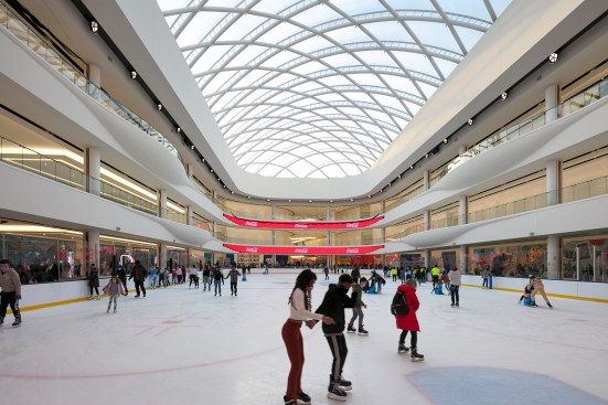 The indoor skating rink, which epitomizes the project's clean, white palette.