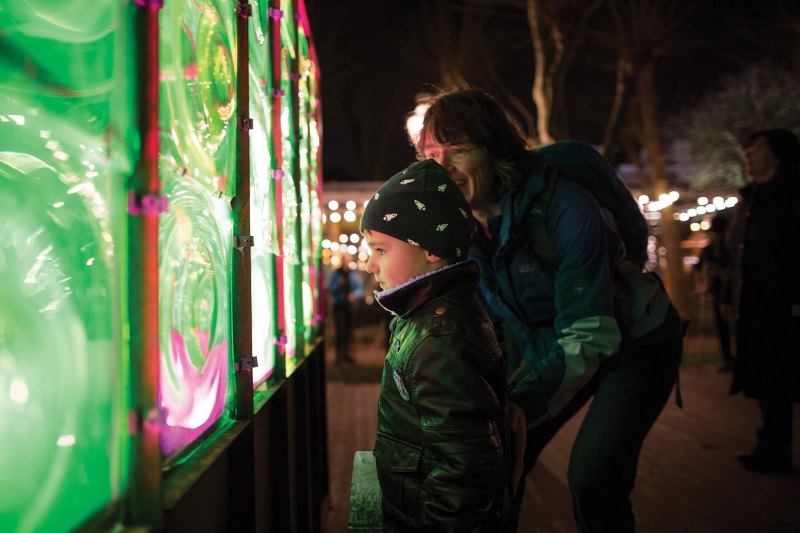 Visitors to the 2016 Amsterdam Light festival are intrigued by artist Victor Engbers’ illuminated Greenhouse.