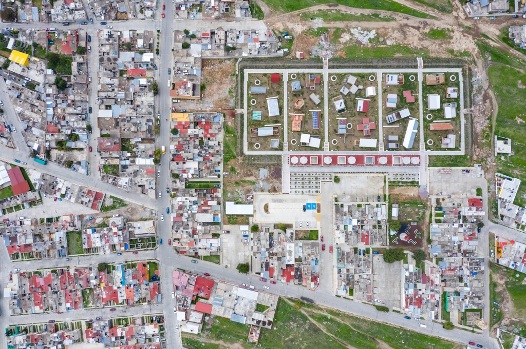 Aerial view of the Apan Housing Laboratory, which was master planned by MOS. The welcome and education center designed by MOS is at the base of the site, adjacent to 32 affordable house prototypes, each designed by a different firm.