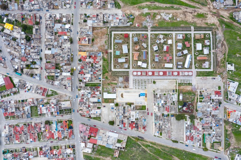 Aerial view of the Apan Housing Laboratory, which was master planned by MOS. The welcome and education center designed by MOS is at the base of the site, adjacent to 32 affordable house prototypes, each designed by a different firm.