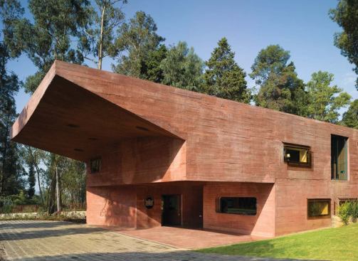 Ethiopia

Royal Netherlands Embassy, Addis Ababa, Ethiopia, 2005 (Dick van Gameren
 and Bjarne Mastenbroek) The concrete of the long, low main embassy 
building is pigmented red to allude to the historic rock-hewn buildings 
of Ethiopia.