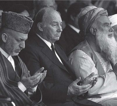 The Aga Khan (center) 
joins Afghan president Hamid Karzai (left) and Abdul Rasul Sayyaf 
(right), a Pashtun warlord turned Afghan legislator, in praying at the 
funeral of Mohammed Zahir Shah-Afghanistan's last king-in July 2007. 
Above right: the jury and steering committee for the 2004-2007 cycle, 
which include Hani Rashid, Billie Tsien, and Brigitte Shim.