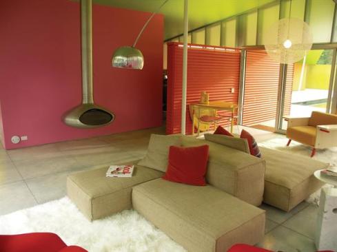 The painted corrugated aluminum extends into the living spaces.