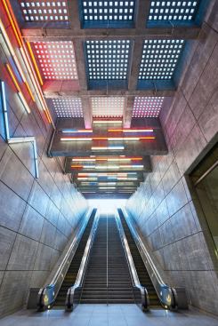 Light+filters+through+sidewalk-level+pavers.