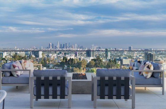City views from the entertainment terrace deck with fire feature and outdoor dining. 