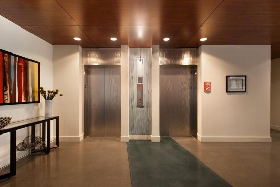 Elevator doors and transoms shown in Stainless Steel with Seastone finish and Campagne pattern at The Matisse, Portland, Oregon