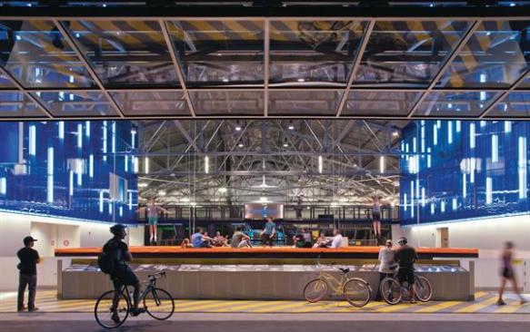 The open door allows passersby to see people training on three high-performance trampolines.