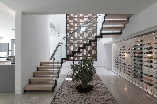 Atelier RZLBD / Stack House / staircase, terracotta screen, garden, wine cellar