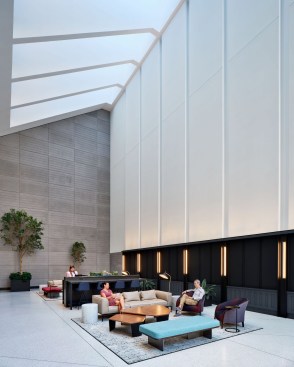 The highlight of Columbia Property Trust and Spectorgroup’s redesign of 95 Columbus in Jersey City is an all-glass entrance and building vestibule that seamlessly connects the building to the surrounding neighborhood and fills the triple-height lobby with natural daylight, accented by the custom artwork installation Brushes for Beuys (2021), a series of large, shaped canvases by contemporary artist Gregory Coates.