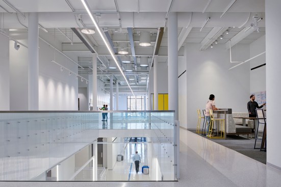 An interior atrium slices through the building 36’ high and skylights fill the space with ever-changing reflective energy.