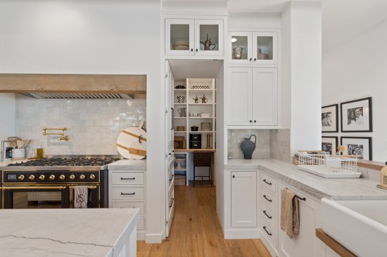 The hidden pantry offers discreet storage while maintaining a clean and organized appearance.