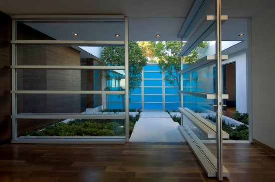 Hopen Place Hollywood Hills modern home glass pivot door entrance