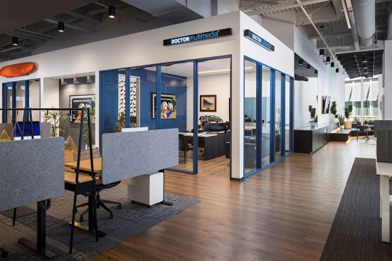Wide corridors connect varying types of workspaces 