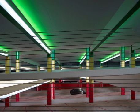 View looking north at the parking ramp between levels 1 and 2. All lighting is programmed to be on during peak morning and afternoon 'rush-hours.' During non-peak hours, every fourth row of lighting is off for energy conservation purposes.